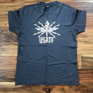 Nike Track & Field T. Slate grey w/cream colored graphic. Purchased in Paris.